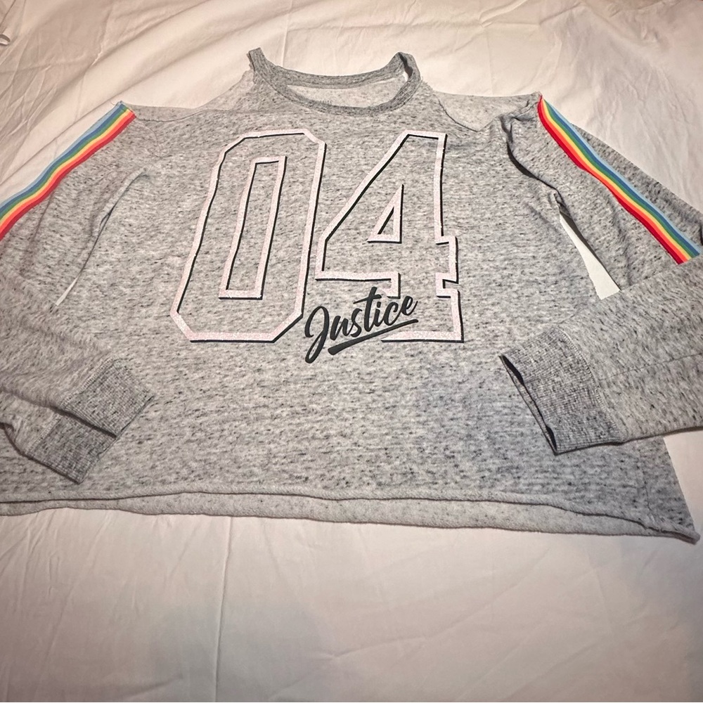 I’m selling a justice cropped sweatshirt with rainbow sleeves.
